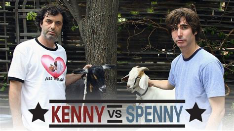 Kenny and Spenny standing outdoors with goats.